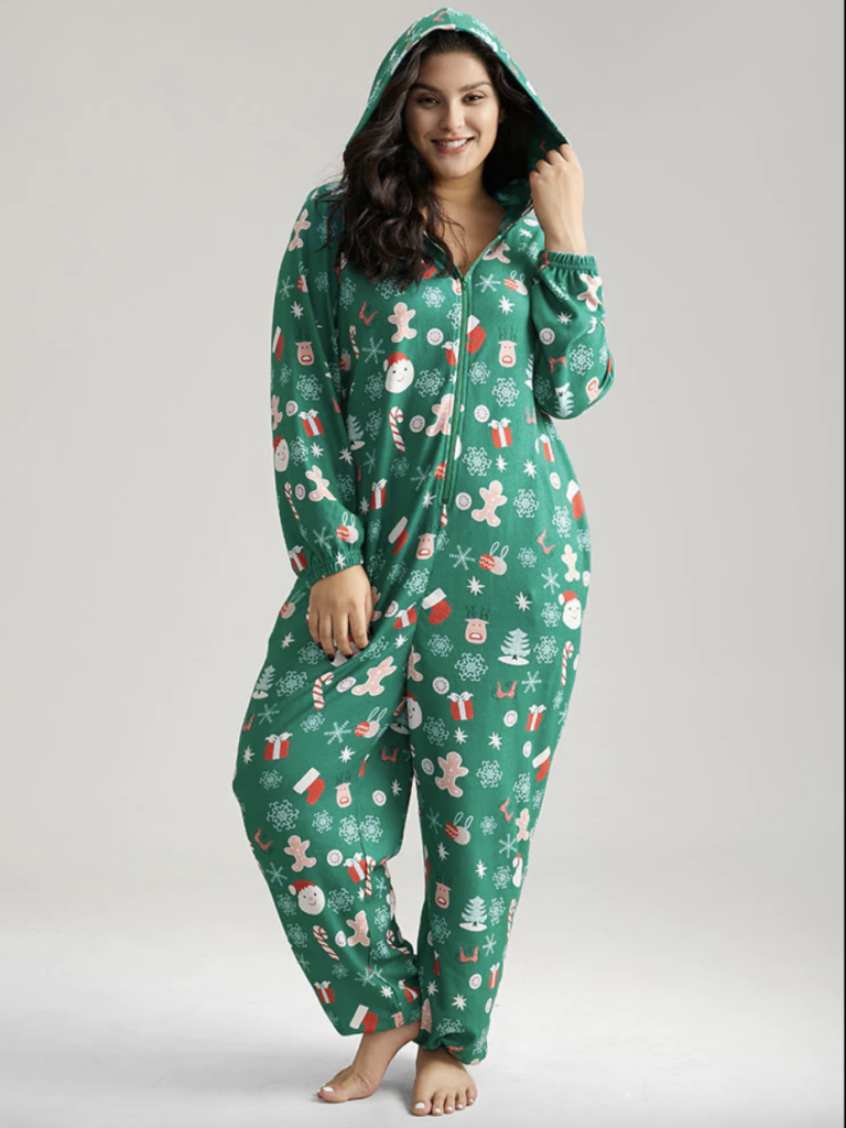 green holiday printed zip-up hooded onesie with gingerbread man, snowflake, stocking, and present pattern